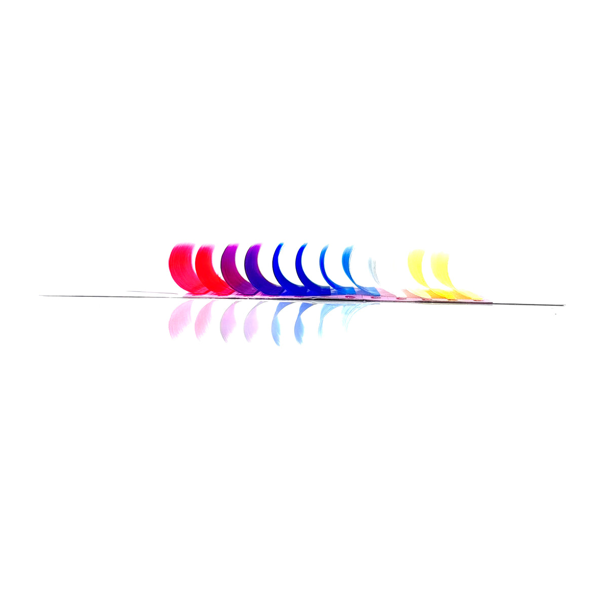 Side angle of OG Color Lash Tray displaying colorful CC curl .05 lash rows – white, pink, purple, blue, yellow Side angle of OG Color Lash Tray displaying colorful CC curl .05 lash rows – white, pink, purple, blue, yellow
