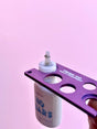 Glue Nozzle Remover in use – removing lash adhesive cap for cleaner glue application Glue Nozzle Remover in use – removing lash adhesive cap for cleaner glue application